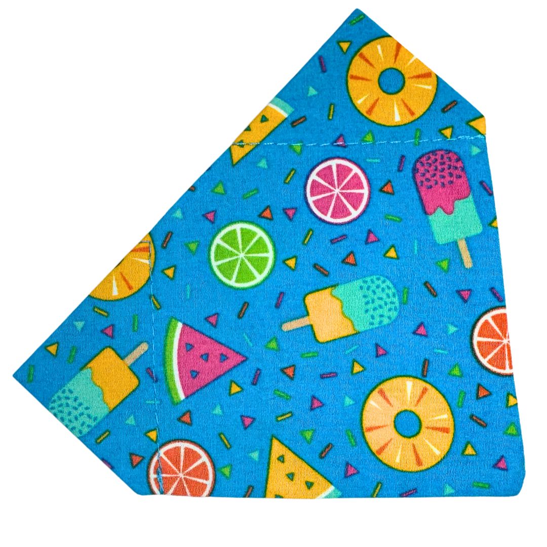 Colourful fabric bandana with summer-themed patterns on a blue background