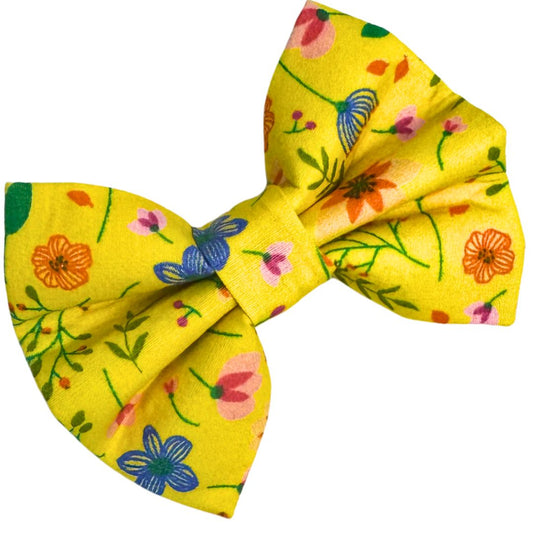 Yellow dog bow with a floral pattern in pink and blue