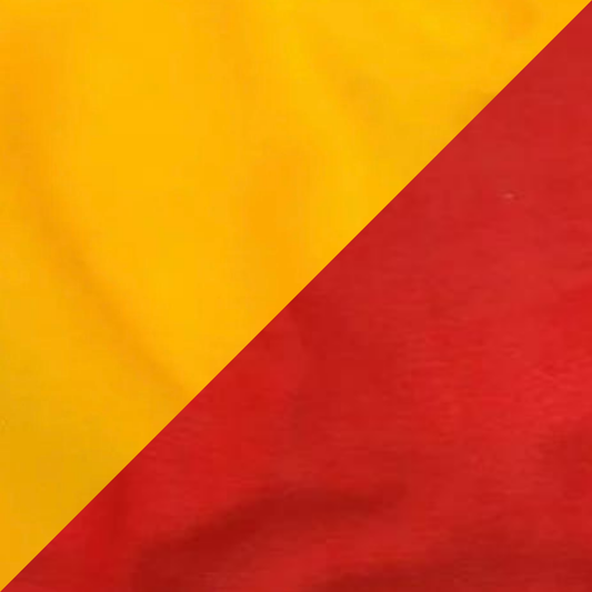 A reversible fleece dog snood with one side yellow and the other burnt orange.