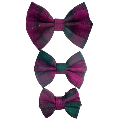 Three tartan dog bows in purple or plum and green.