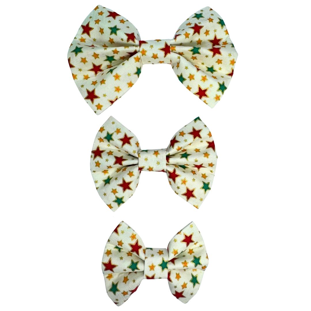Three colourful star-patterned dog bows.