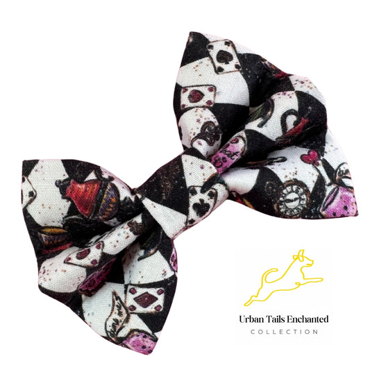 A dog bow tie with characters and motifs from the Alice in Wonderland story, on a black and white check background.