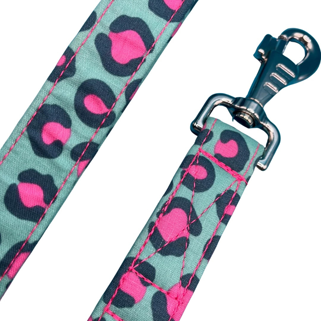 A close up of a sassy leopard print dog lead with a large swivel clip and metal D ring