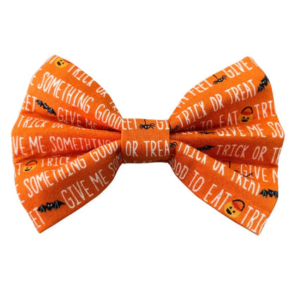 Halloween-themed orange bow tie with text and graphics on a white background